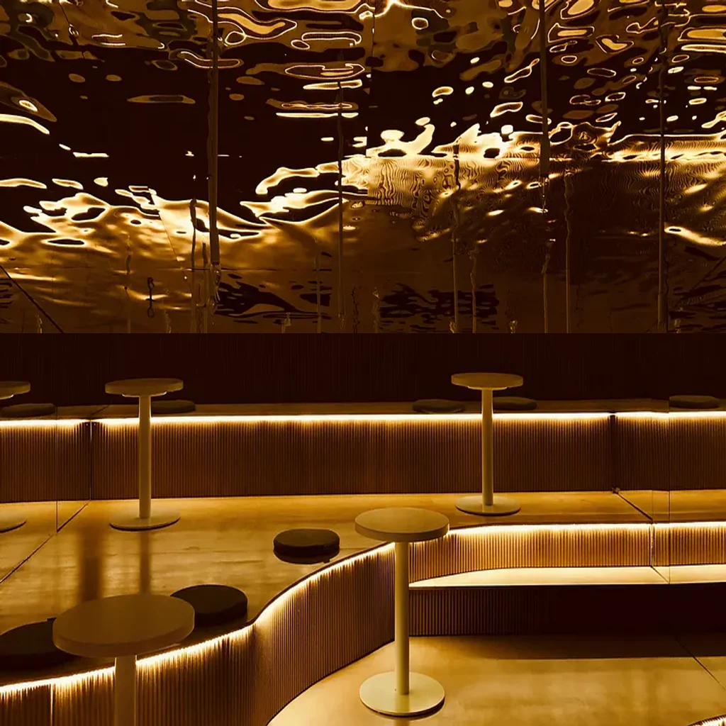 Warm mirrored interior illuminated by continuous architectural lighting